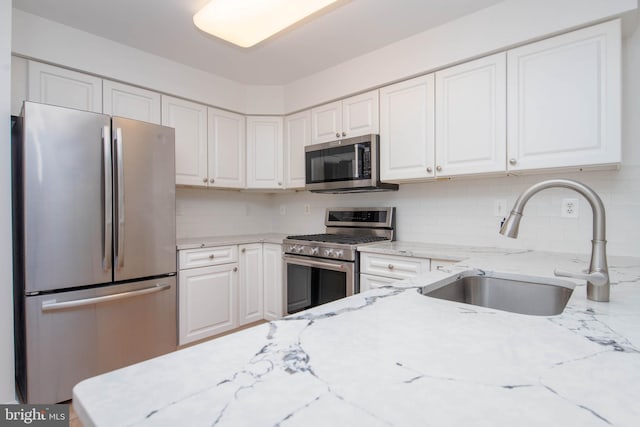 12030 Tralee Rd Unit 306, Lutherville Timonium, MD 21093 - kitchen featuring stainless steel appliances, white cabinetry, and tasteful backsplash