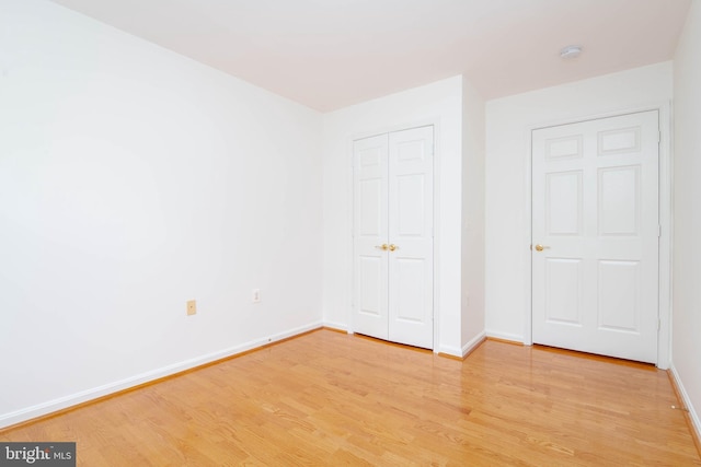 12030 Tralee Rd Unit 306, Lutherville Timonium, MD 21093 - unfurnished bedroom featuring light wood-type flooring and a closet
