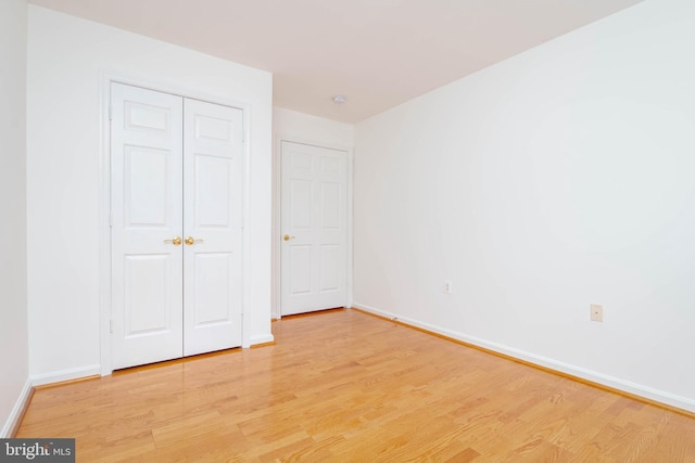 12030 Tralee Rd Unit 306, Lutherville Timonium, MD 21093 - unfurnished bedroom featuring light wood-type flooring and a closet