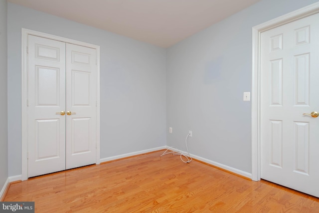 12030 Tralee Rd Unit 306, Lutherville Timonium, MD 21093 - unfurnished bedroom with light wood-style flooring and a closet