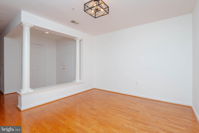 12030 Tralee Rd Unit 306, Lutherville Timonium, MD 21093 - spare room with decorative columns and light wood-style flooring