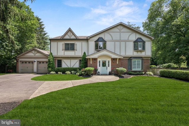 236 Carriage Hill Dr, Moorestown, NJ 08057 - english style home with concrete driveway, a front lawn, stucco siding, brick siding, and an attached garage