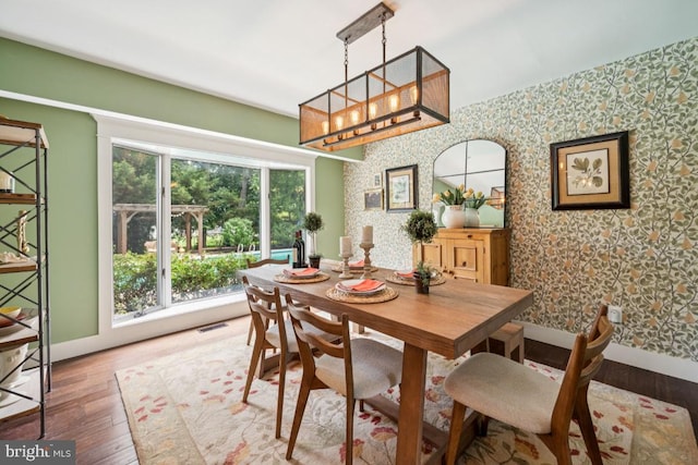 236 Carriage Hill Dr, Moorestown, NJ 08057 - dining space with wallpapered walls, wood finished floors, and a chandelier