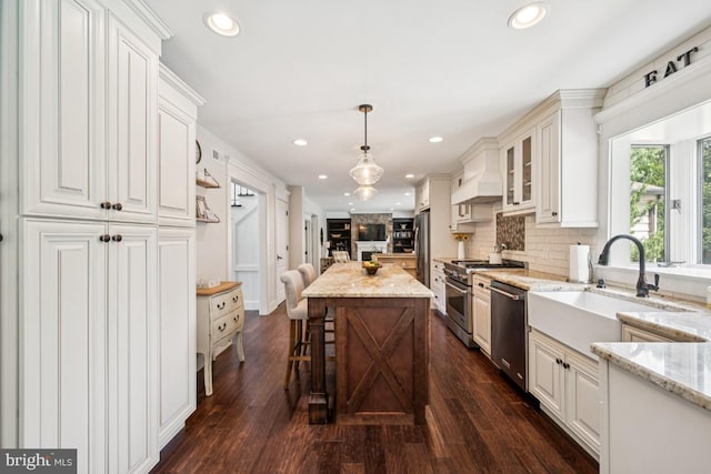 236 Carriage Hill Dr, Moorestown, NJ 08057 - kitchen with stainless steel appliances, glass insert cabinets, decorative backsplash, light stone countertops, and recessed lighting