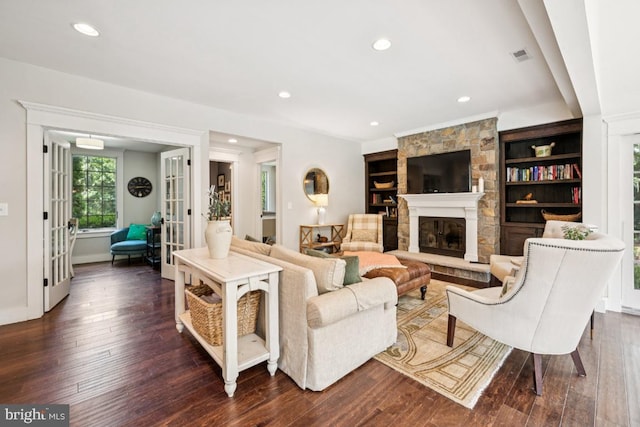 236 Carriage Hill Dr, Moorestown, NJ 08057 - living room with french doors, dark wood-type flooring, a stone fireplace, and recessed lighting