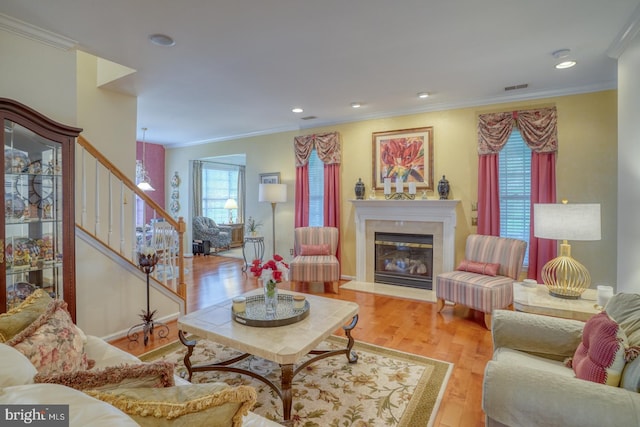 577 Whispering Trl, Middletown, DE 19709 - living area with stairway, wood finished floors, crown molding, a fireplace, and recessed lighting