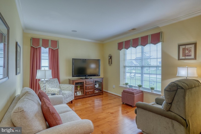 577 Whispering Trl, Middletown, DE 19709 - living area with light wood-style floors, crown molding, and plenty of natural light