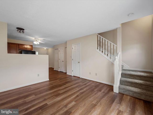 2635 Limestone Ct, Winchester, VA 22601 - unfurnished living room with dark wood finished floors, stairs, and ceiling fan