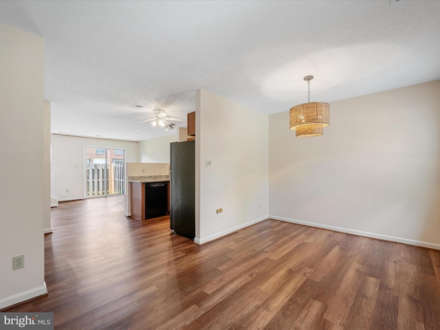 2635 Limestone Ct, Winchester, VA 22601 - unfurnished living room featuring dark wood-style floors and a ceiling fan