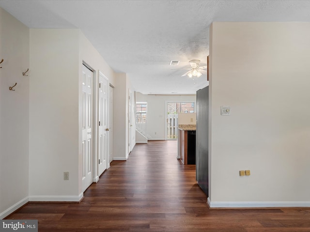 2635 Limestone Ct, Winchester, VA 22601 - corridor with dark wood finished floors and a textured ceiling