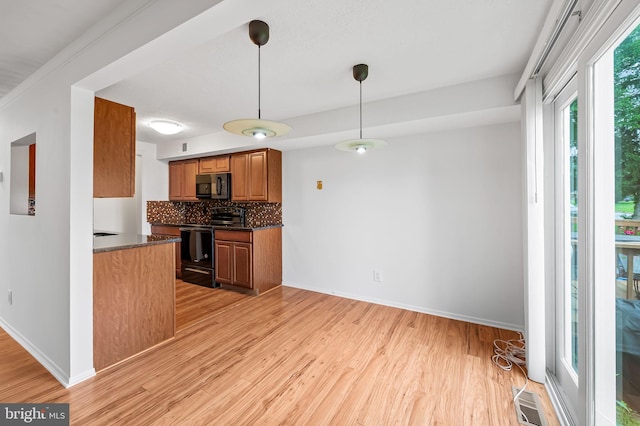 2 Brookshire Dr Unit A, Reisterstown, MD 21136 - kitchen with black appliances, light wood finished floors, decorative backsplash, and brown cabinets