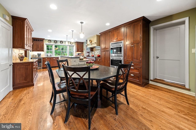 4105 Meadow Ln, Newtown Square, PA 19073 - dining room featuring light wood finished floors, wine cooler, and recessed lighting