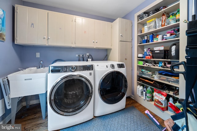 4105 Meadow Ln, Newtown Square, PA 19073 - washroom featuring cabinet space, wood finished floors, and separate washer and dryer