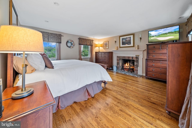 4105 Meadow Ln, Newtown Square, PA 19073 - bedroom with wood finished floors and a fireplace