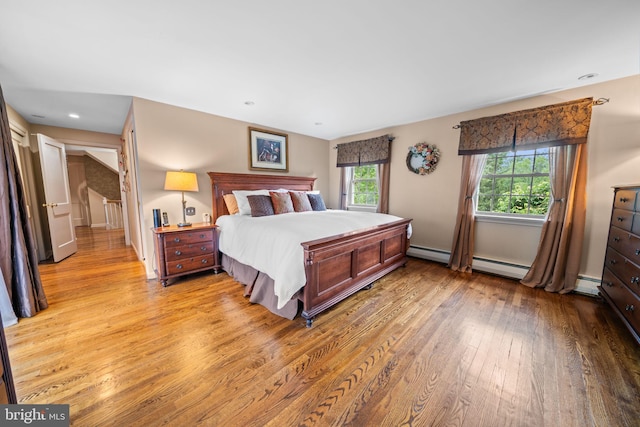4105 Meadow Ln, Newtown Square, PA 19073 - bedroom with light wood-type flooring, baseboard heating, and recessed lighting