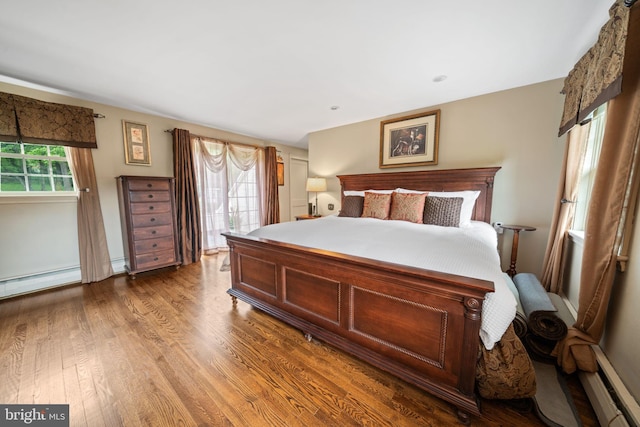 4105 Meadow Ln, Newtown Square, PA 19073 - bedroom with wood finished floors, baseboard heating, and access to outside