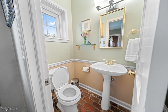 4105 Meadow Ln, Newtown Square, PA 19073 - half bathroom featuring brick floors and baseboards