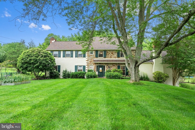 4105 Meadow Ln, Newtown Square, PA 19073 - view of front of home with a front lawn, stucco siding, a chimney, and stone siding