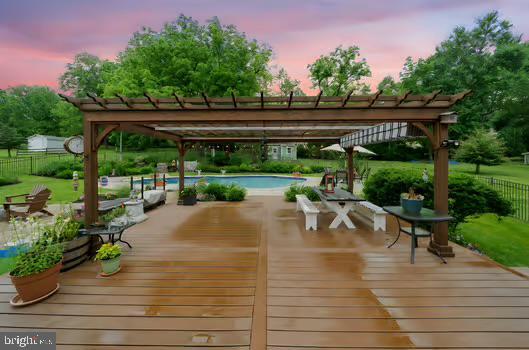 4105 Meadow Ln, Newtown Square, PA 19073 - deck at dusk featuring a pergola