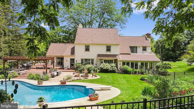4105 Meadow Ln, Newtown Square, PA 19073 - back of property featuring a chimney, a pergola, a patio, and an outdoor fire pit