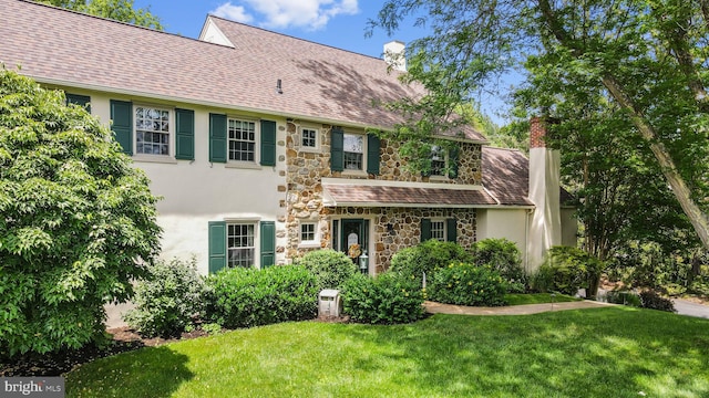 4105 Meadow Ln, Newtown Square, PA 19073 - view of front of home with a chimney, stone siding, stucco siding, and a front yard