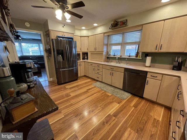 914 New Hope St, Norristown, PA 19401 - kitchen featuring stainless steel fridge, dishwasher, a ceiling fan, light countertops, and light wood-style floors