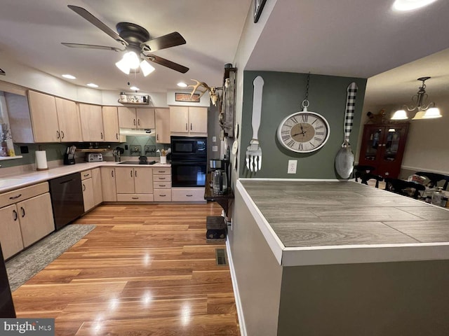 914 New Hope St, Norristown, PA 19401 - kitchen featuring black appliances, ceiling fan, light wood-style floors, under cabinet range hood, and recessed lighting