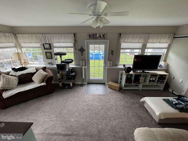 914 New Hope St, Norristown, PA 19401 - carpeted living room featuring a ceiling fan and baseboards