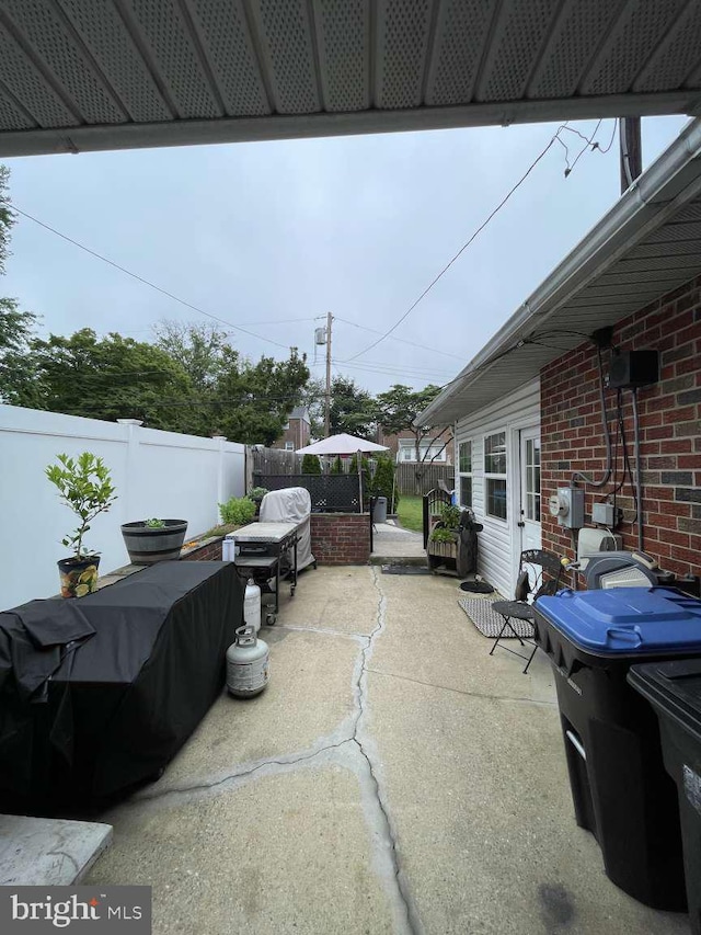 914 New Hope St, Norristown, PA 19401 - fenced backyard with a patio area and a grill