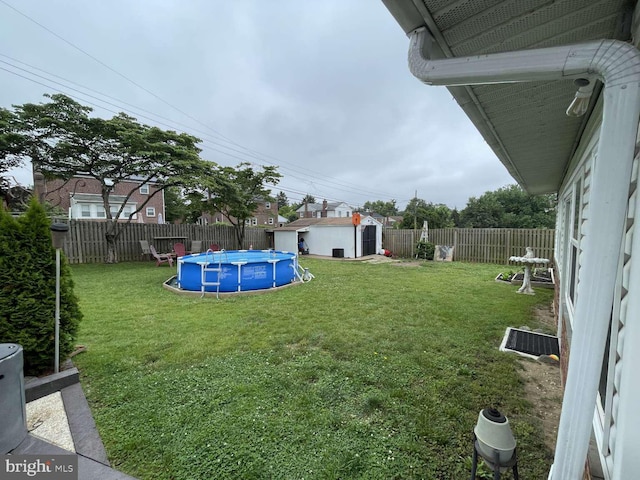 914 New Hope St, Norristown, PA 19401 - fenced backyard featuring a storage unit