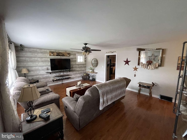 914 New Hope St, Norristown, PA 19401 - living room featuring a ceiling fan, wood finished floors, and wooden walls