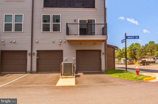 43792 Middleway Ter, Ashburn, VA 20147 - view of property with an attached garage, a balcony, and driveway