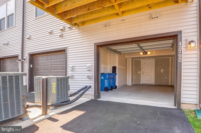 43792 Middleway Ter, Ashburn, VA 20147 - garage featuring a garage door opener