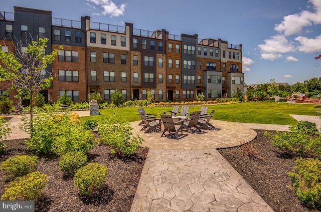 43792 Middleway Ter, Ashburn, VA 20147 - surrounding community featuring a lawn and a patio
