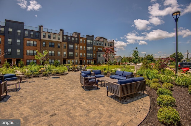43792 Middleway Ter, Ashburn, VA 20147 - view of home's community with an outdoor living space and a patio