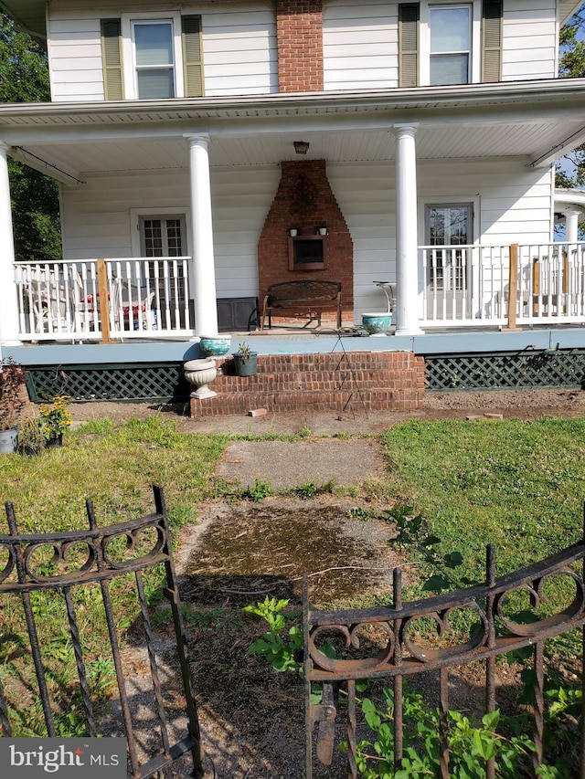 3107 Evergreen Ave, Baltimore, MD 21214 - view of exterior entry with a porch and brick siding