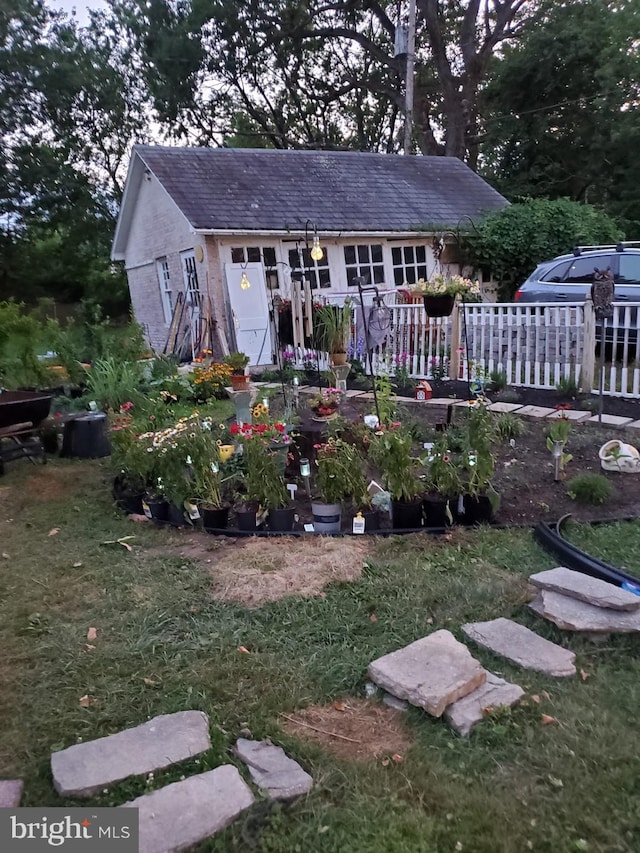 3107 Evergreen Ave, Baltimore, MD 21214 - back of house featuring a garden and a lawn