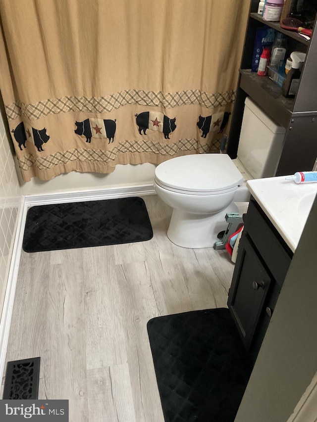 26 Crossings View Rd, Paw Paw, WV 25434 - bathroom with vanity, wood finished floors, a shower with curtain, and a tub to relax in