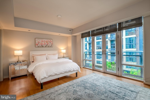 1025 1st St SE Unit 713, Washington, DC 20003 - bedroom with access to exterior and wood finished floors
