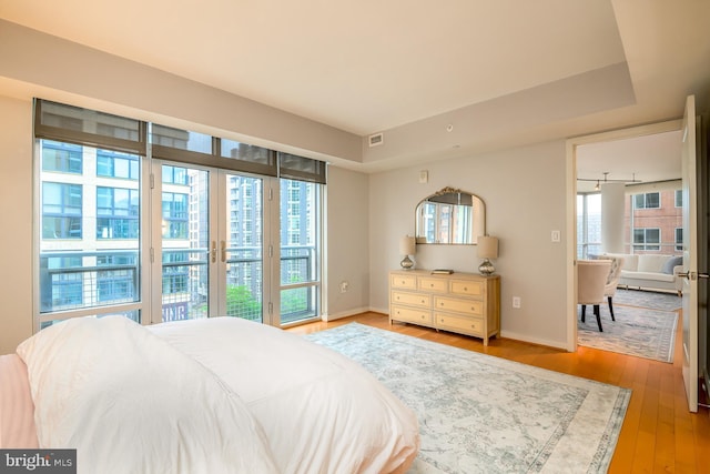 1025 1st St SE Unit 713, Washington, DC 20003 - bedroom featuring access to exterior and wood finished floors