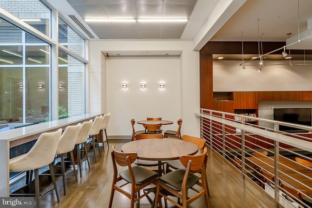1025 1st St SE Unit 713, Washington, DC 20003 - dining area featuring wood finished floors and wood walls