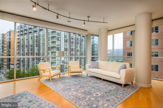 1025 1st St SE Unit 713, Washington, DC 20003 - living area featuring wood-type flooring, a city view, and ornate columns