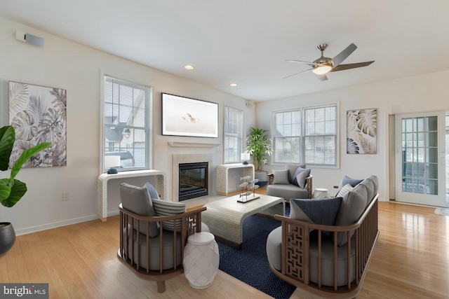 14 Doolin Ln, Rehoboth Beach, DE 19971 - living area with light wood-style flooring, a tile fireplace, ceiling fan, and recessed lighting