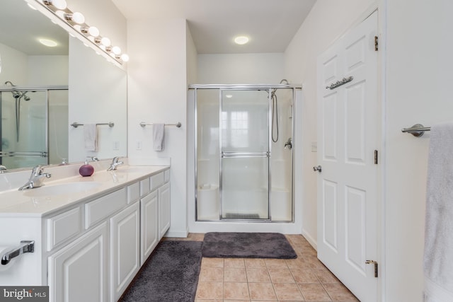 14 Doolin Ln, Rehoboth Beach, DE 19971 - bathroom with a stall shower, double vanity, and tile patterned floors