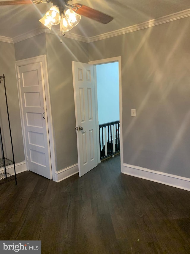 6370 Marsden St, Philadelphia, PA 19135 - spare room featuring a ceiling fan, dark wood-style floors, and crown molding