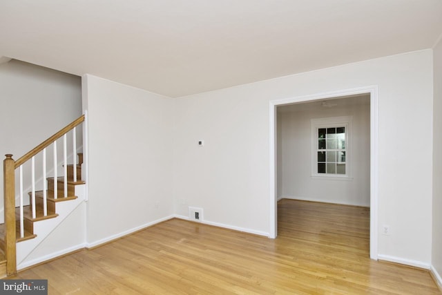 6016 N Kings Hwy, Alexandria, VA 22303 - spare room with light wood-type flooring and stairway