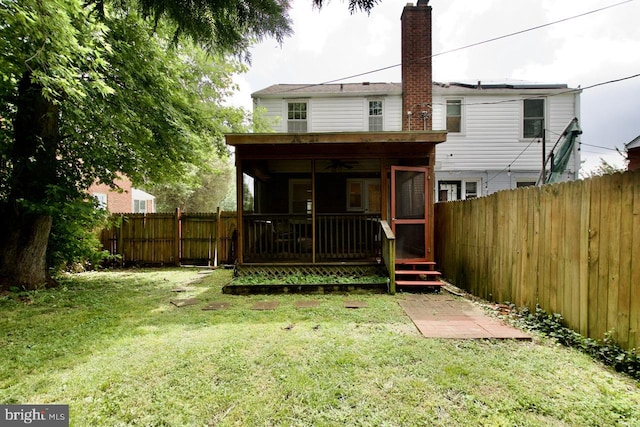 6016 N Kings Hwy, Alexandria, VA 22303 - rear view of house with a ceiling fan, a chimney, a fenced backyard, and a sunroom