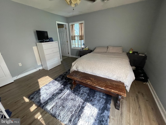 103 N W St, Harrington, DE 19952 - bedroom with wood finished floors and a ceiling fan