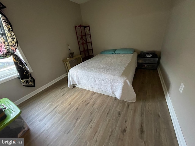 103 N W St, Harrington, DE 19952 - bedroom with wood finished floors and baseboards