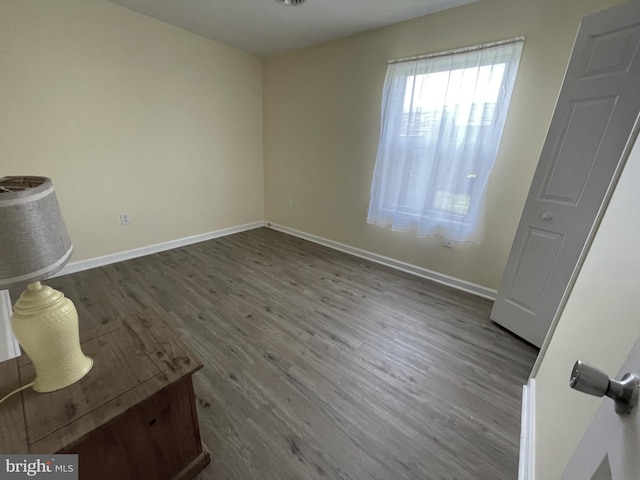 103 N W St, Harrington, DE 19952 - unfurnished bedroom with wood finished floors and baseboards